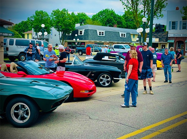 car show with cars and people
